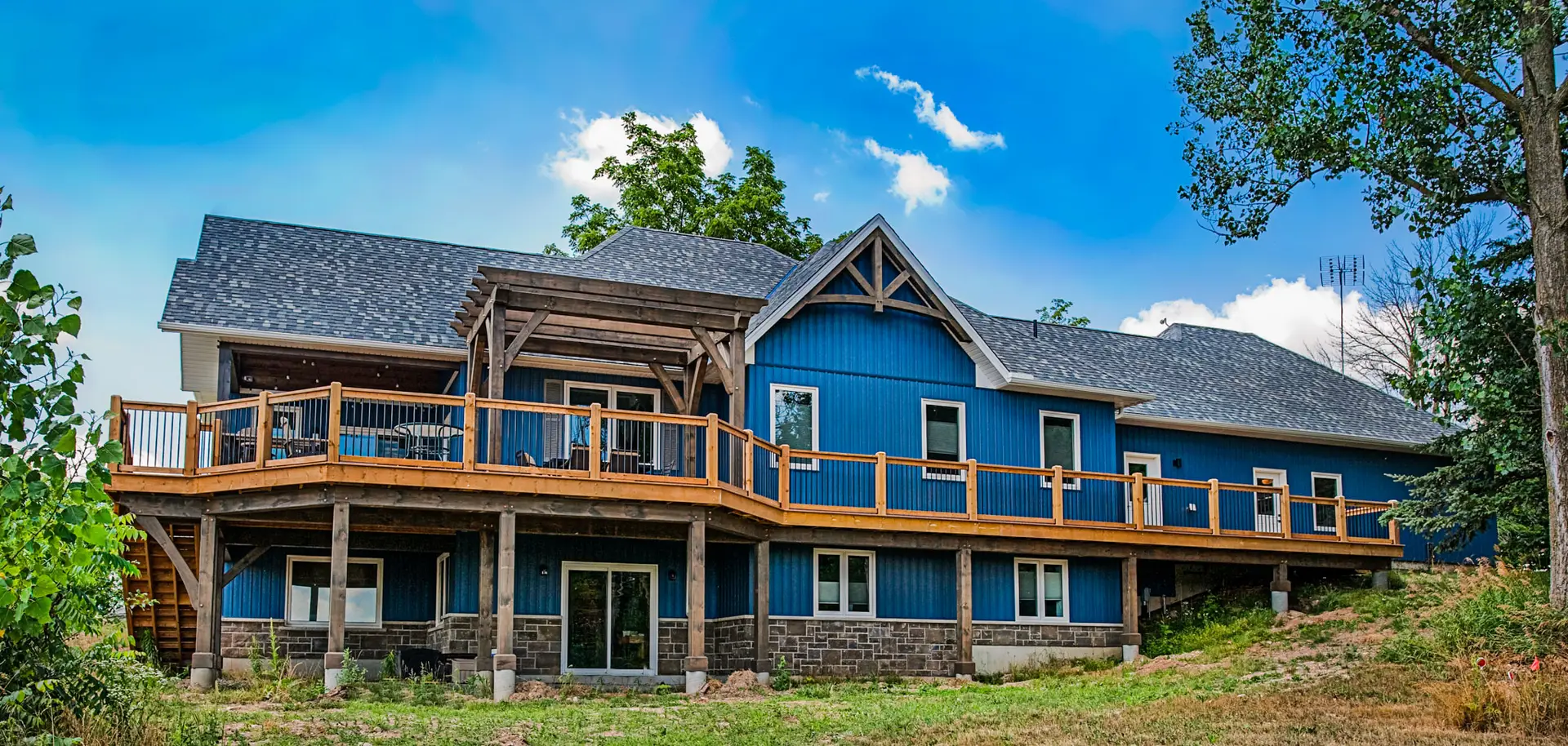 Custom Siderman House with blue, board and batten vinyl siding