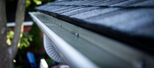 new eavestrough, featuring a downspout and gutter guard